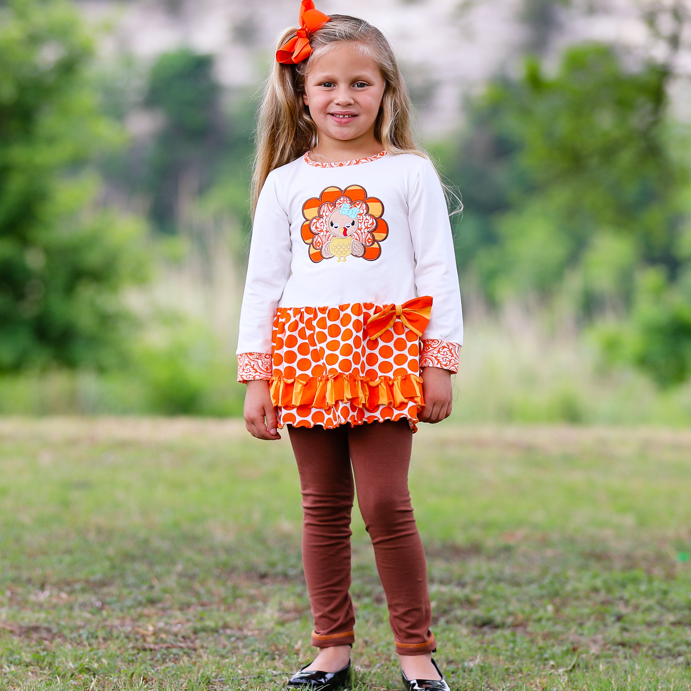 AnnLoren Big Little Girls Autumn Turkey Tunic & Leggings featuring a turkey applique, cream tunic, and orange knit leggings.